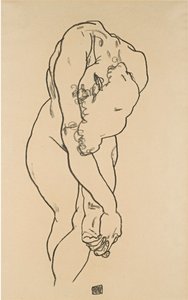 Nu accroupi avec la tête baissée